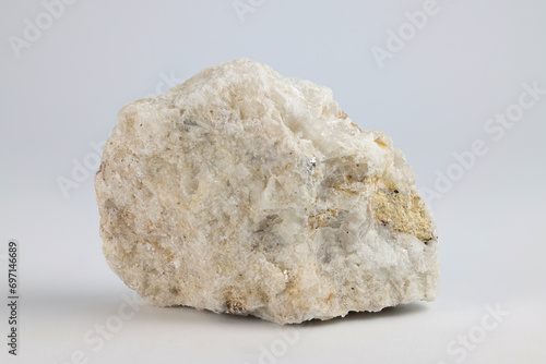 Albite is a white plagioclase feldspar mineral used in the manufacture of glass and ceramics photo