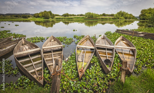 small wooden boats over lake