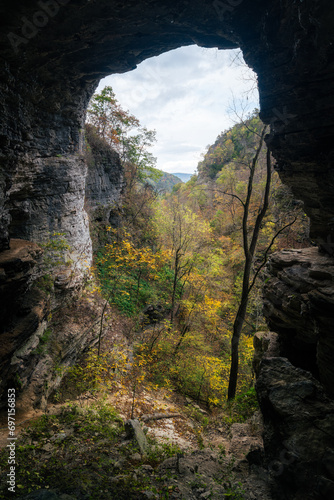 Cave view looking out towards fall foliage and Indian Creek