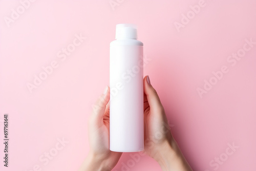 White empty facewash bottle in women hand