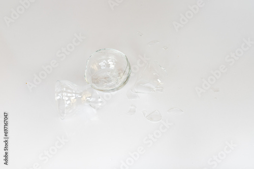 Broken glass vase with sharp edges isolated on white background