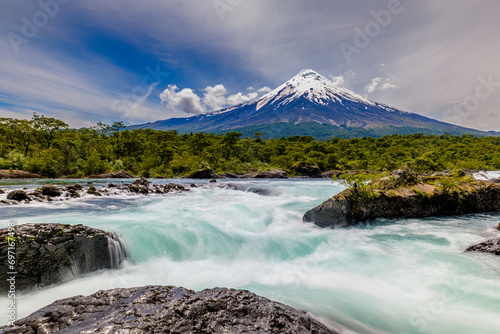Petrohué Waterfalls with snow-capped Osorno Volcano seen in the background, Vicente Pérez Rosales National Park, Lake District, Chile