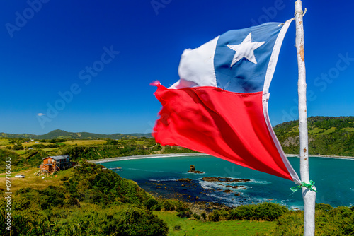 A view from Islotes de Punihuil with Chilean flag seen in foreground photo