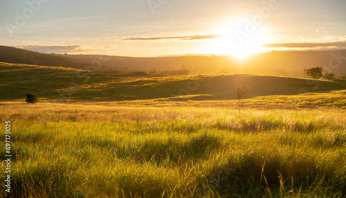 Golden Sunrise Over the Rolling Hills  A Scenic Morning View of the Rural Meadow