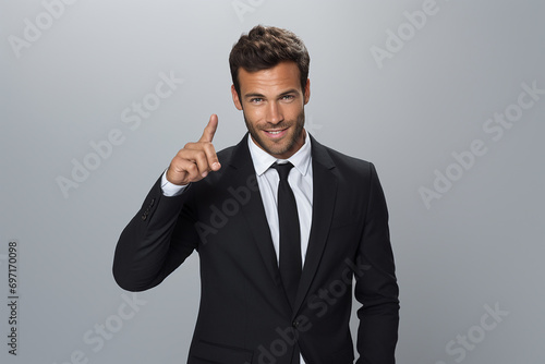 young smiling man in formal wear pointing with finger on you
