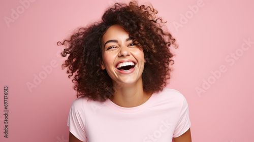 Happy wonderful young woman with long hair, excited funny woman. Isolated on pink background