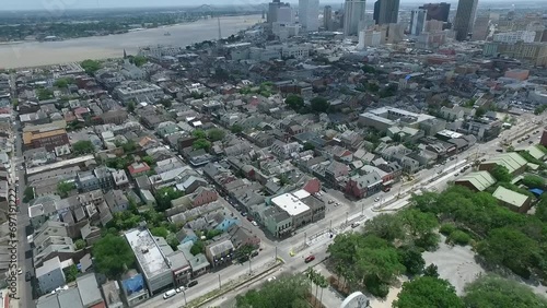 New Orleans Louisiana Cityscape and City Skyline in Background. Cloudy Sky Mississippi river and Louis Armstrong Park. Drone photo