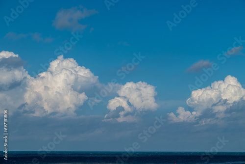 Blue sky, clouds and the sea at Katwijk, The Netherlands.