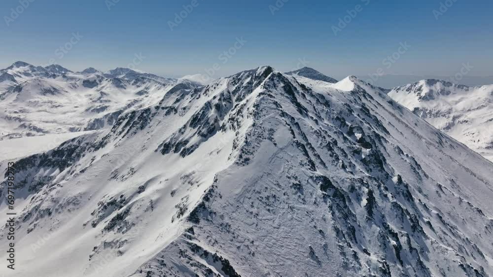 Aerial rising view Alps mountains snowy peaks in sunny day with high clouds. Majestic breathtaking mountains landscape. Drone Aerial Flight Over Swiss Mountain Range. Panoramic aerial footage Aerial rising view Alps mountains snowy peaks in sunny day with high clouds. Majestic breathtaking mountains landscape. Drone Aerial Flight Over Swiss Mountain Range. Panoramic aerial footage