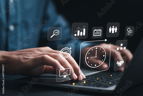 Time management concept. Businessman use laptop to work planning for increases efficiency and reduces work time. Business project planning.