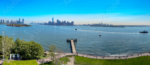 Panoramic view from the pedestal of the Statue of Liberty of the New York City skyline, showing the skyscrapers of the Big Apple and Manhattan.