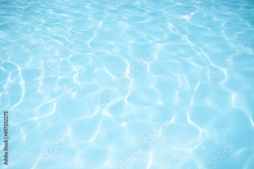 surface of blue swimming pool, background of water in swimming pool. © urzine