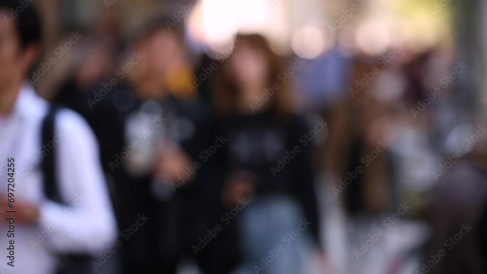 Blurry People in City. Business District. Rush Hour Time People Are Walking on the Sidewalk. Asian People Blurry People in City. Business District. Rush Hour Time People Are Walking on the Sidewalk. Asian People