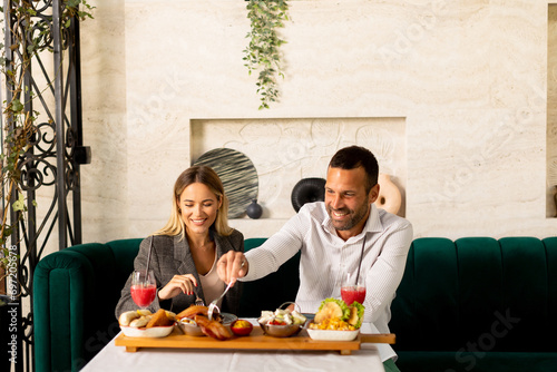 Young couple having lunch a...