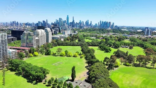 Melbourne, Australia: Aerial view of skyscraper skyline of Melbourne central business district (CBD) in capital city of Victoria, taken from Fawkner Park on sunny day with clear blue sky photo