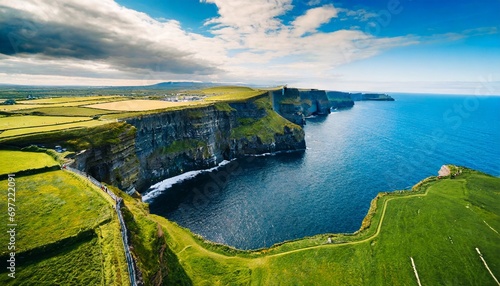 aerial view of the cliffs of moher in ireland beautiful blue ocean and green grassy fields generative ai photo