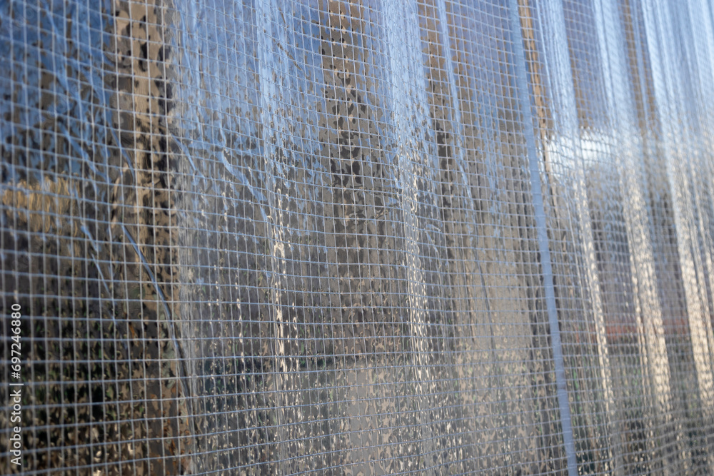 Fototapeta premium 防炎糸入り透明ビニールカーテンのクローズアップ背景