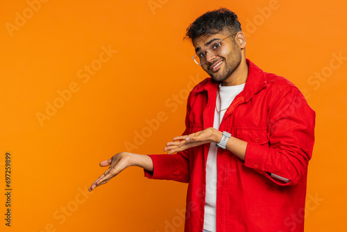 Indian man raising hands asking what why reason of failure, demonstrating disbelief irritation by troubles social media meme anti lifehacks ridicules people who complicate simple tasks for no reason photo
