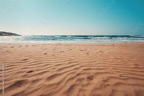 Breathtaking view of beach azure sea meets golden shore creating picturesque scene of tranquility and natural beauty. Gentle waves kiss sandy coastline under warm glow of sun