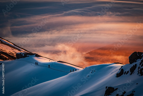 Hikers on the Kilimanjaro crater rim at sunrise