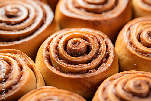 a close up of a bunch of cinnamon rolls photo