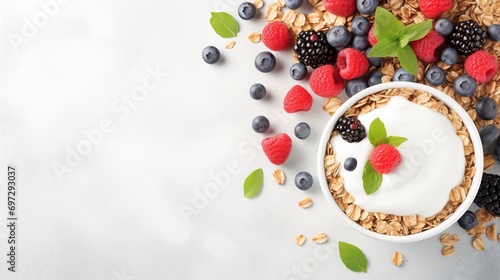 Scrumptious and nutritious breakfast bowl featuring yogurt adorned with fresh blueberries, raspberries, blackberries and oats. a wholesome and delicious start to the day.