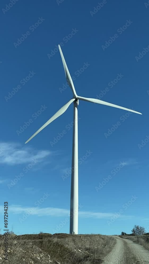 Line of Massive Wind Turbines, subjective visit from a car. Concept of ecological transition renewable energy climate change green energy. There is no planet b. Green energy choice concept. Line of Massive Wind Turbines, subjective visit from a car. Concept of ecological transition renewable energy climate change green energy. There is no planet b. Green energy choice concept.
