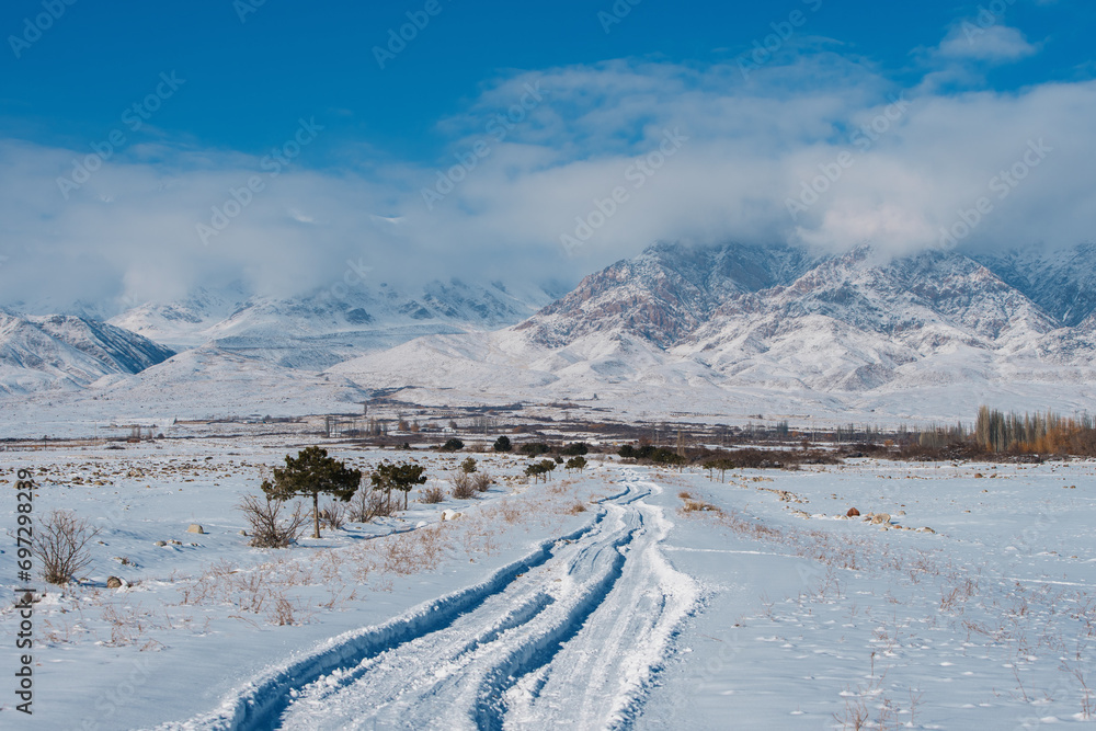 Picturesque mountain landscape with snow covered road