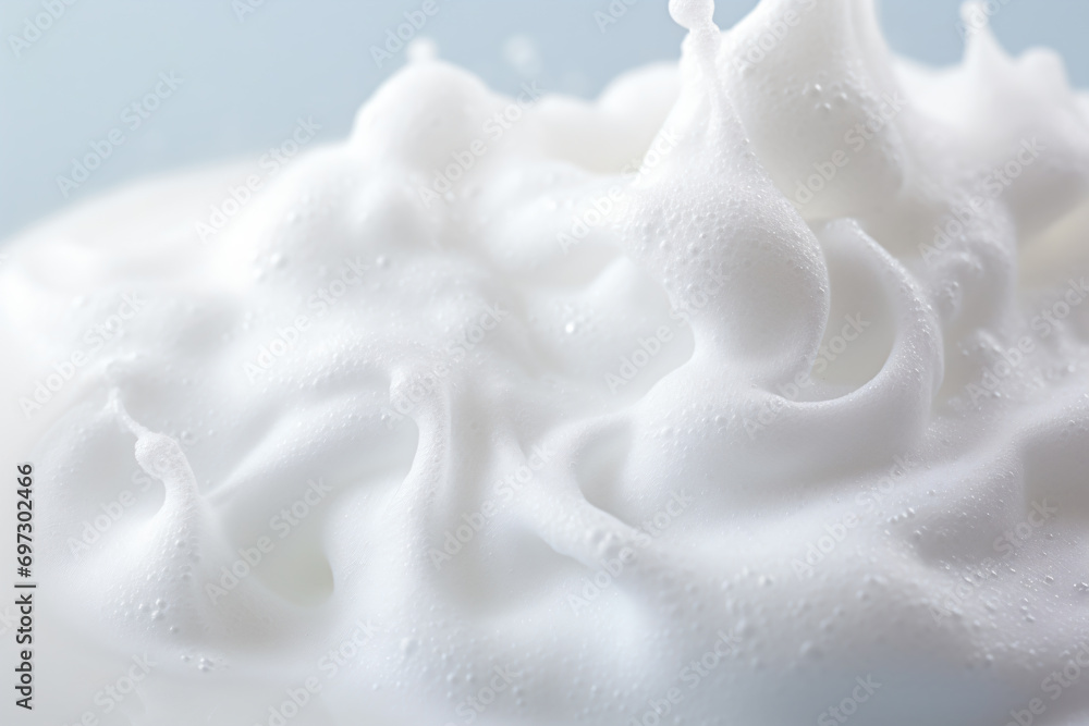 a close up of a whipped cream with a blue background a close up of a whipped cream with a blue background