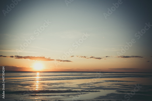 Beautiful sunset near the shore on the sea  background with sunset  orange sunset