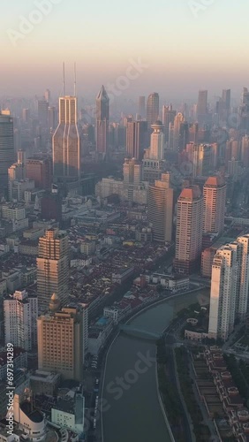 Shanghai Skyline in the Sunny Morning. Puxi District. China. Aerial View. Drone is Flying Forward. Establishing Shot. Vertical Video photo
