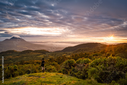 Sunrise and Muhabura volcano from camp on Karisimbi volcano, Rwanda photo