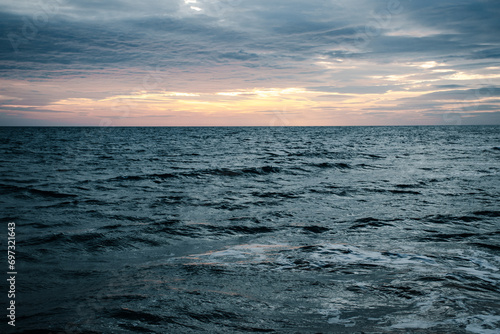 Sunset in Mediterranean sea waves landscape photo. Peaceful seaside time.