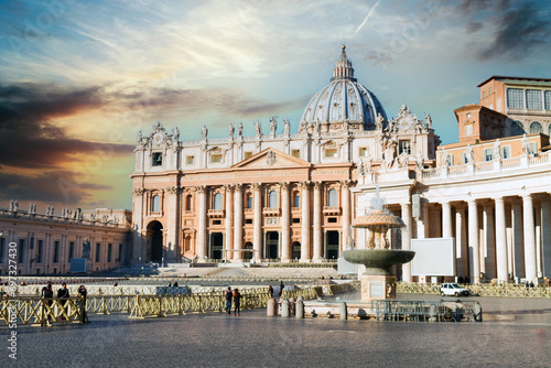 St. Peter's basilica on Saint Peter's square in Vatican at sunrise, center of Rome, Italy (translation "In honor of prince of Apostles; Paul V Borghese, Pope, in year 1612 and 7th year of pontificate)
