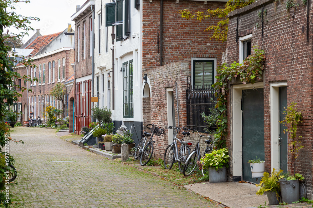 Narrow street with planters in the center of the city of Middelburg in Zeeland.