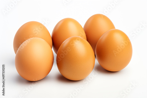 six eggs are arranged in a row on a white surface