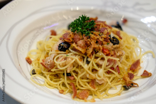 Spaghetti spicy bacon served on a white plate. Soft Focus.