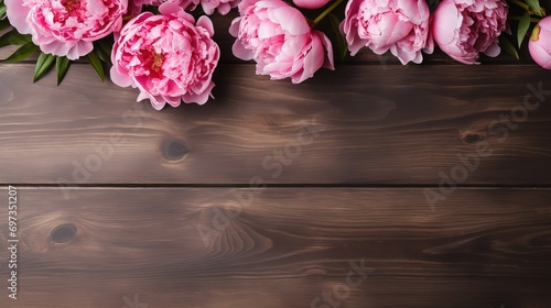 Peony flowers in photo on wooden table © original logo