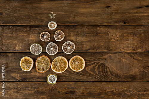 Christmas tree made of slices of dried oranges, lemon and lime Creative Christmas and new year concept.