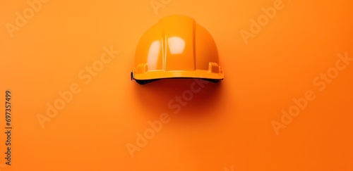 orange safety helmet in photo on orange Background © original logo