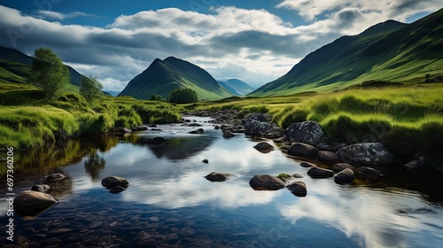 In scotland, a vertical image of a river with mountains and meadows surrounding it.