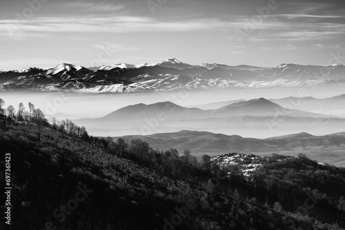 Snow, fog and trees. Winter landscape. Layers. Black and white, monochrome. Mountain Ponikva 2023 Macedonia