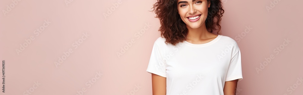 Happy young woman wearing white t-shirt on beige background Happy young woman wearing white t-shirt on beige background