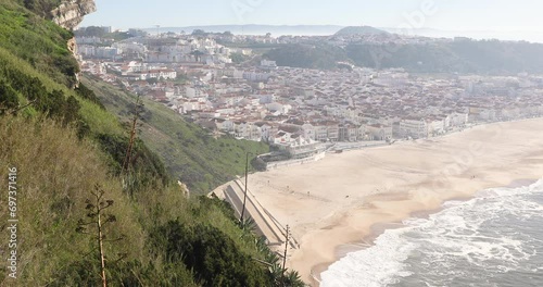 a view over Nazare town and the beach on a foggy winter day, municipality of Alcobaça, district of Leiria, Portugal  photo