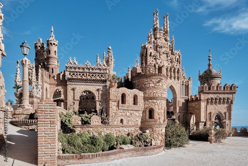 Castillo de Colomares Benalmadena  Malaga  Spain framed by a stone arch with a view to ornate turrets and ramparts