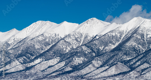 Snow Covered 13,105 Foot Bushnell Peak and 12,865 Foot Mount Otto are part of the Sangre de Cristo Mountain Range in the Northern Section of the San Luis Valley, Colorado. photo
