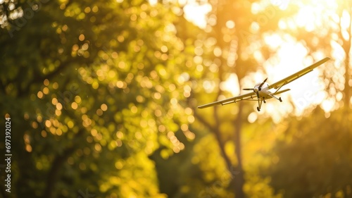 Remote-controlled model airplane flying in a sunlit park photo