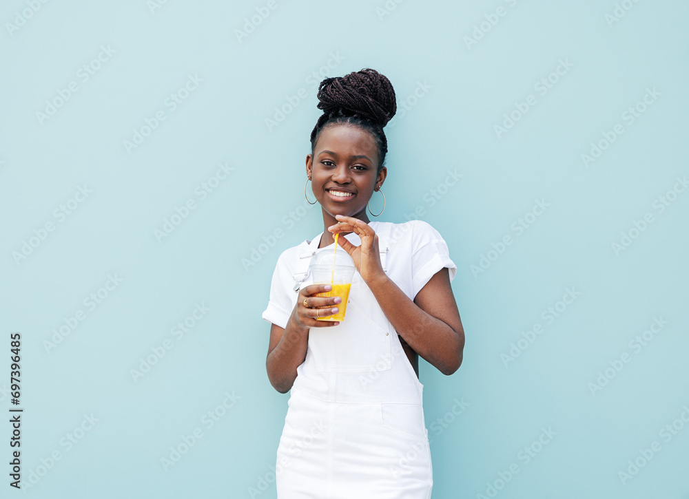 Smiling girl in white casual clothes leaning blue wall and looking at camera Smiling girl in white casual clothes leaning blue wall and looking at camera