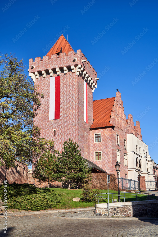 metal entrance gate and tower red brick  reconstructed royal castle   in Poznan