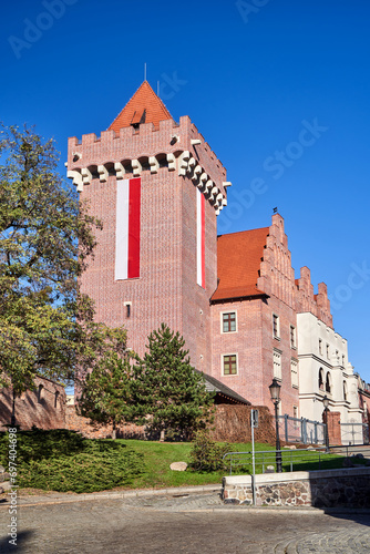 metal entrance gate and tower red brick reconstructed royal castle in Poznan